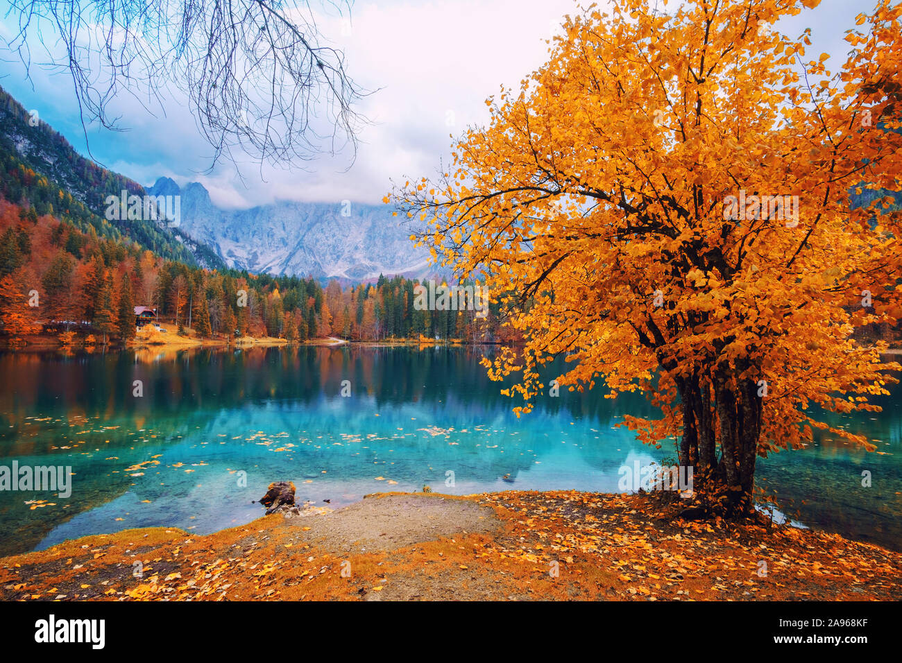 Autumn scenery at lake Fusine - Lago di Fusine-mountain lake in north Italy in the Alps. Stock Photo