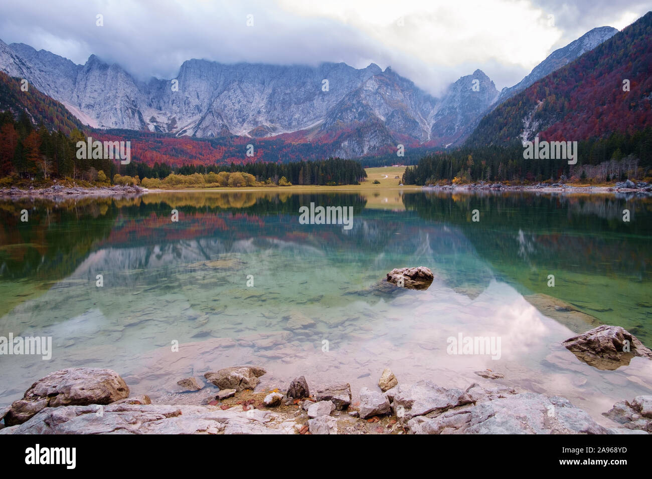 Autumn scenery at lake Fusine - Lago di Fusine-mountain lake in north Italy in the Alps. Stock Photo