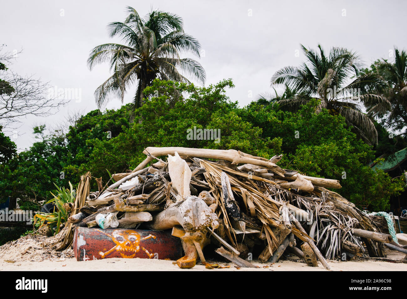 Garbage on the tropical beach as environmental pollution concept Stock Photo
