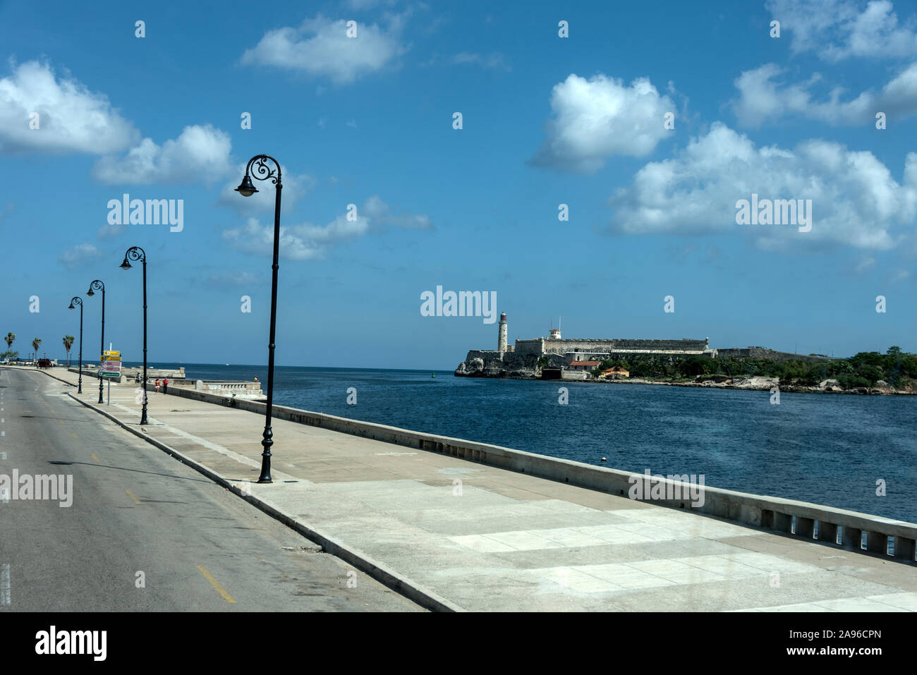 The coastal road that connects with the city’s waterfront, Malecion is ‘Calle 1ra’, facing Havana harbour and the landmark of Castillo De Los Tres Rey Stock Photo