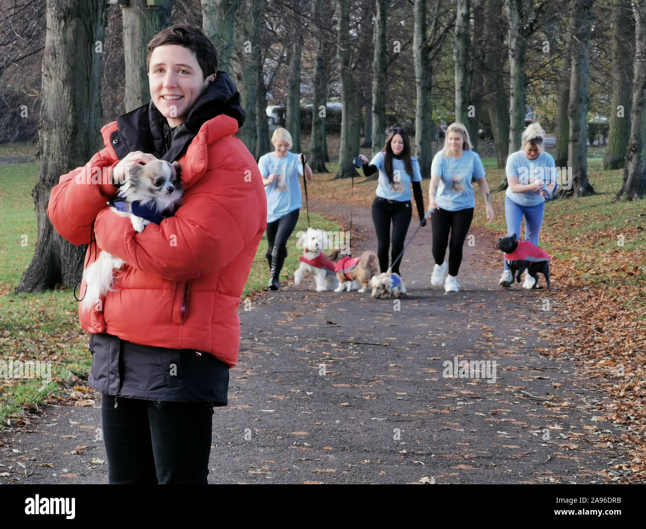 Rural Affairs Minister Mairi Gougeon (left) holds a dog as people from the Buy a Puppy Safely campaign walk dogs through Inverleith Park in Edinburgh. The campaign warning of the dangers of buying puppies from illegal dog breeders and puppy farms is urging people to 'look beyond cute' to avoid misery this Christmas. Stock Photo