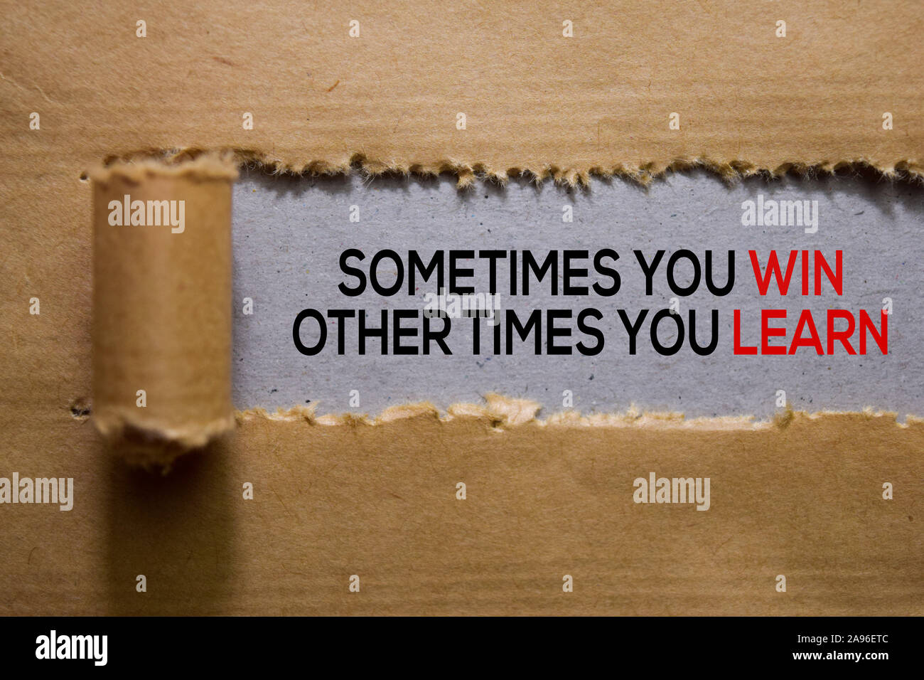 sometimes-you-win-other-times-you-learn-text-written-in-torn-paper-2A96ETC.jpg