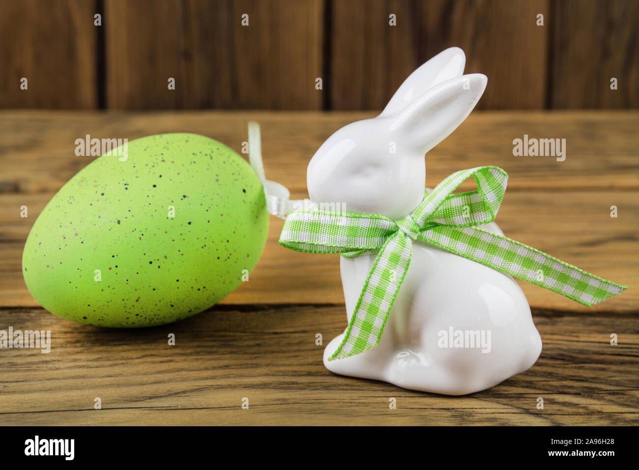 Easter decoration - bunny and green egg Stock Photo - Alamy