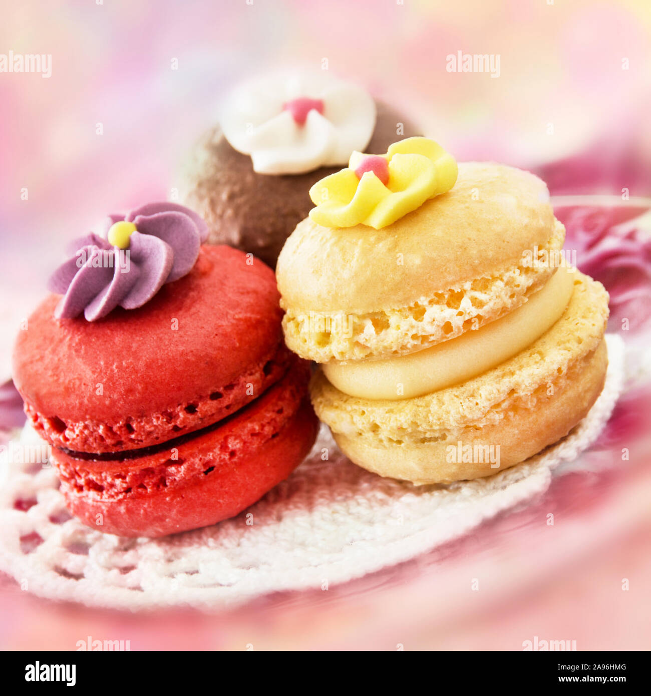 Three macarons and sugar decoration Stock Photo