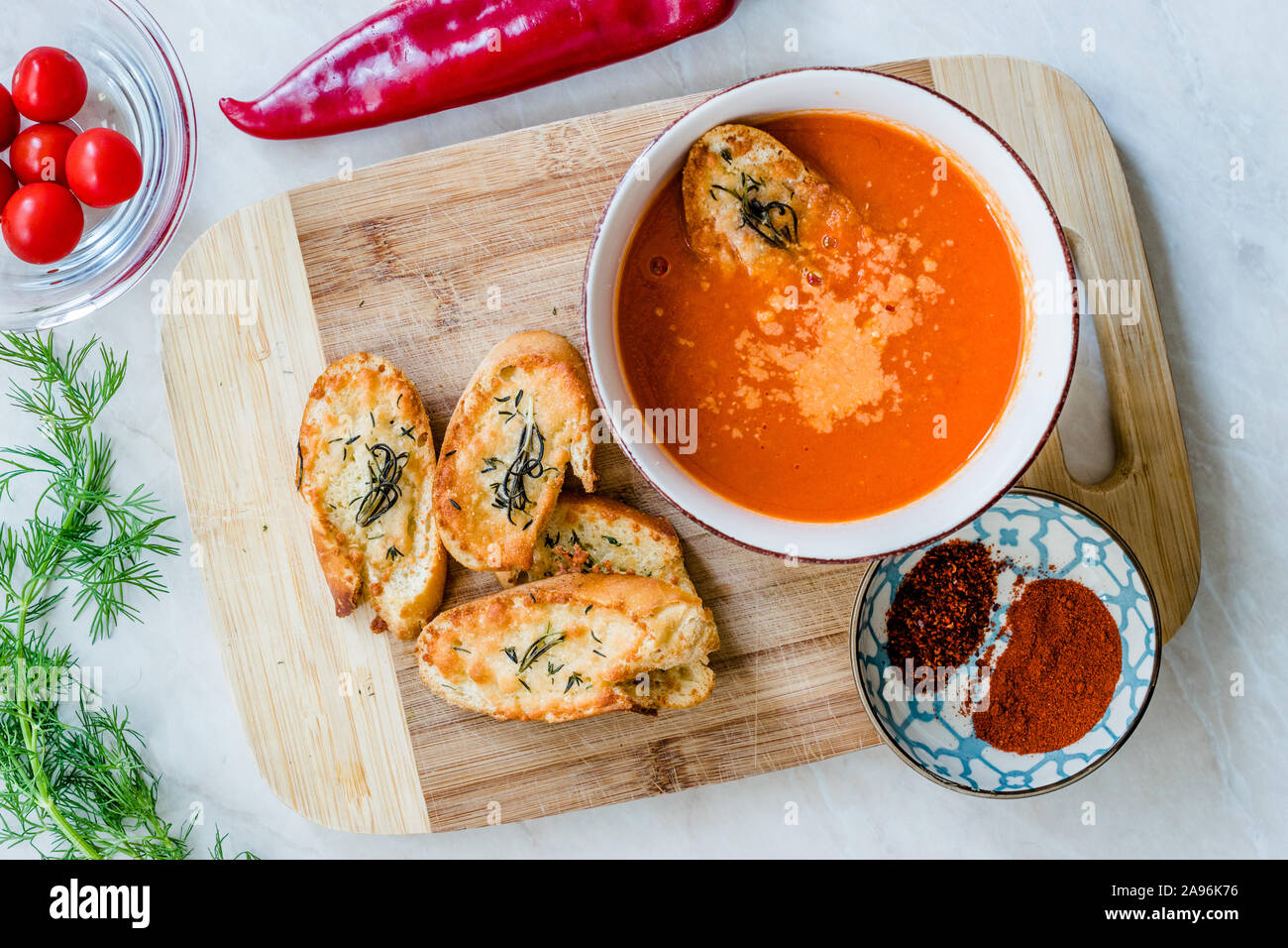 https://c8.alamy.com/comp/2A96K76/tomato-soup-with-parmesan-cheese-bread-in-natural-light-and-sunlight-homemade-organic-food-2A96K76.jpg