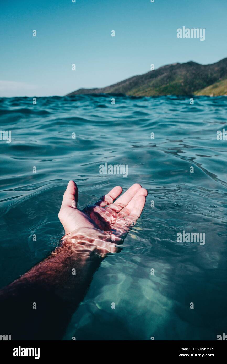 Hand in the water. Stock Photo