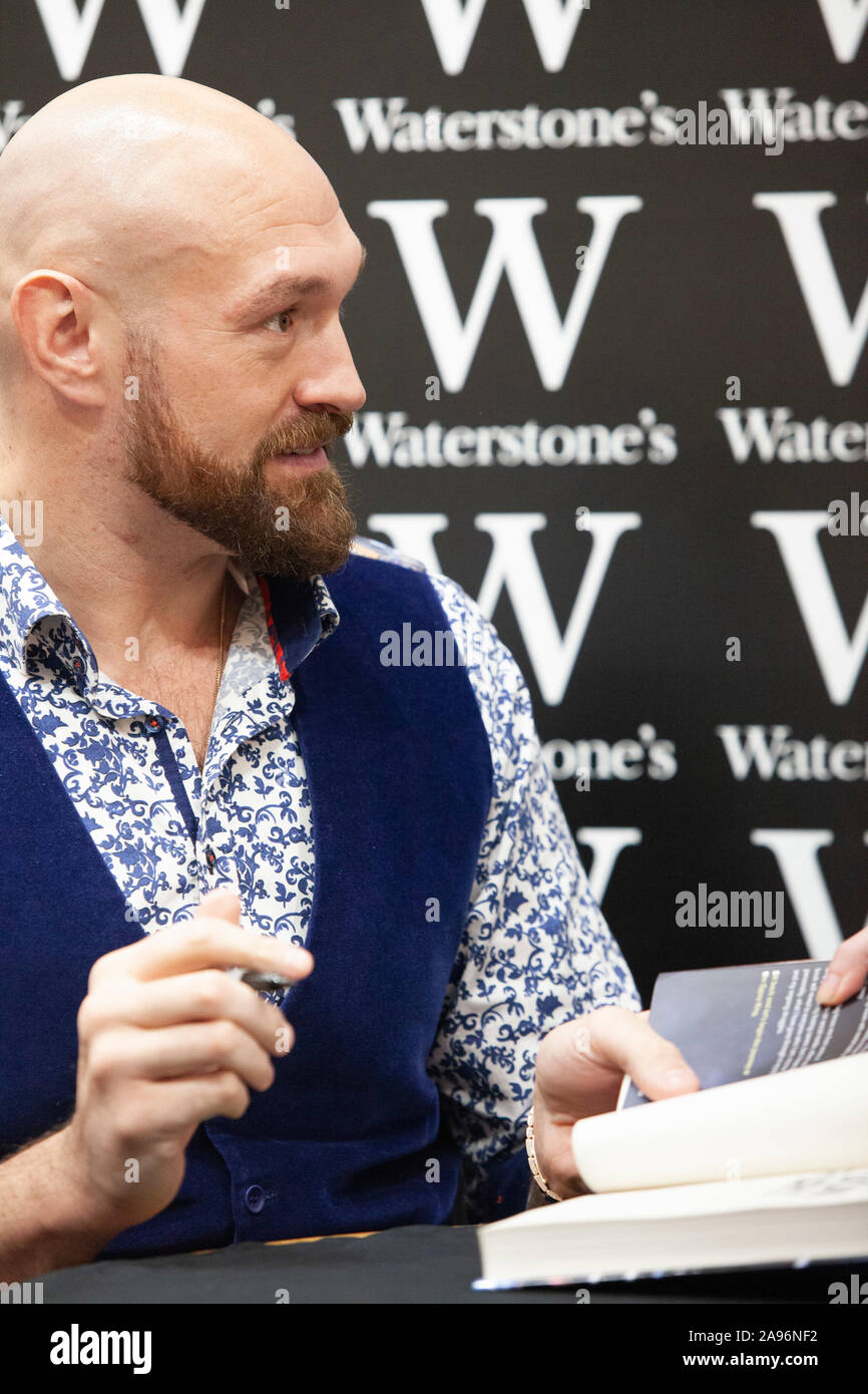 Boxer Tyson Fury delighted hundreds of fans by posing for photos and  signing copies of his book 'Behind the Mask: My Autobiography' at the  Leadenhall branch of Waterstone's in the City of