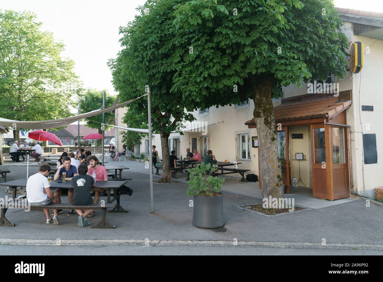 Terrace with people Cafe du Soleil, Saignelégier, Switzerland Stock Photo