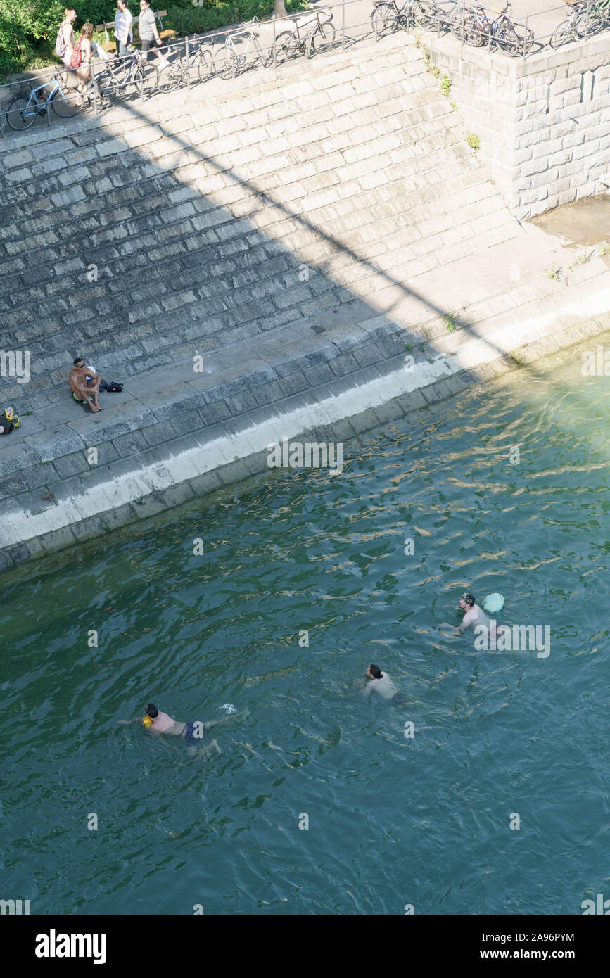 People floating in Rhine river in Basel Stock Photo