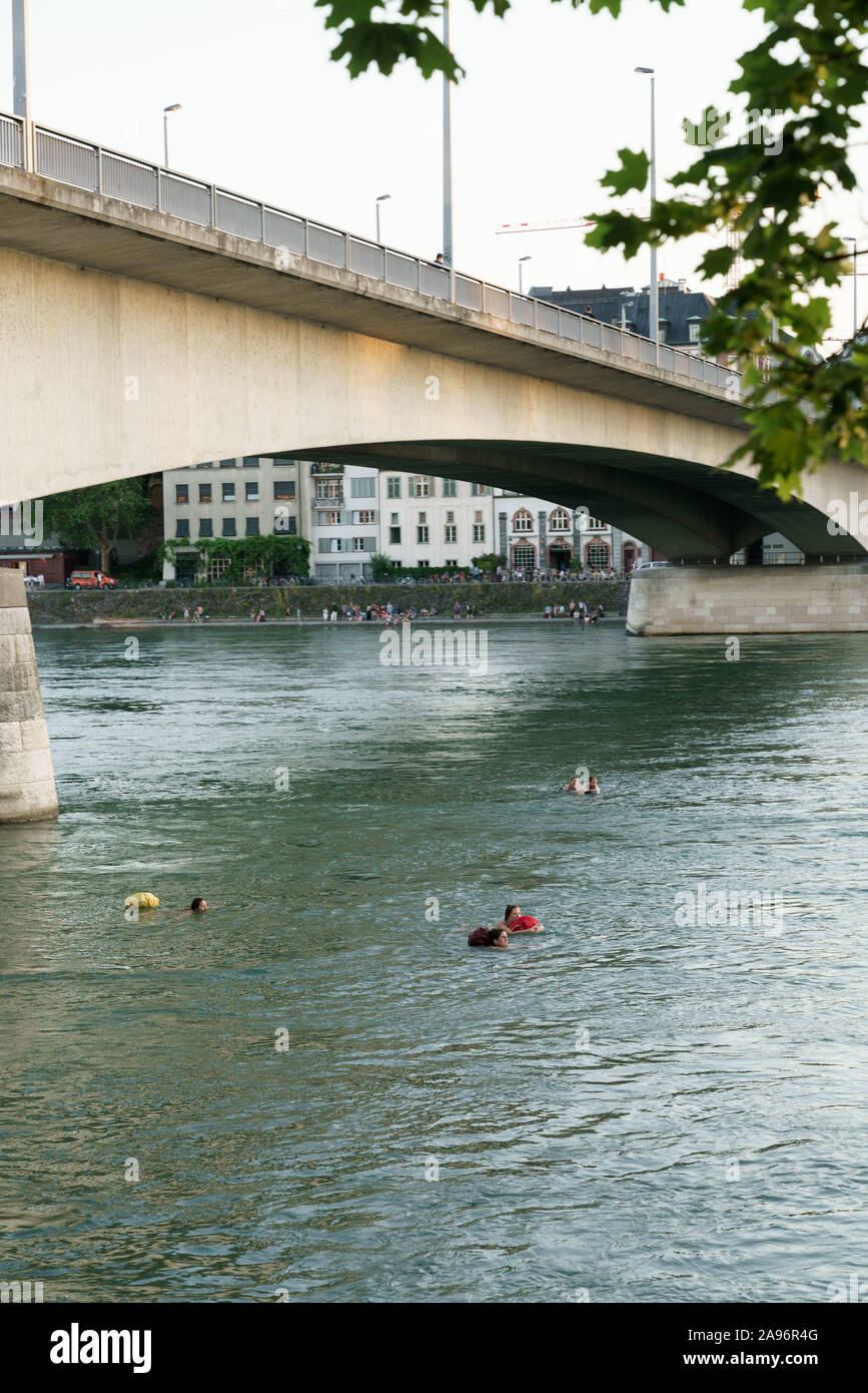 People floating in Rhine river in Basel Stock Photo Alamy