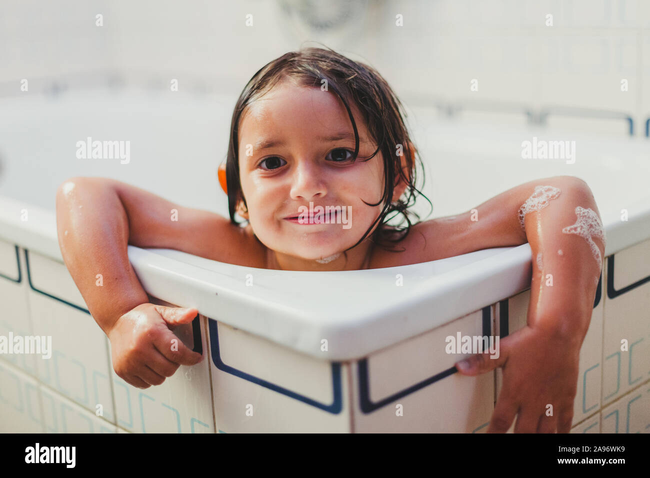 Little girl showering in the bathtub, happy smiling Stock Photo Alamy