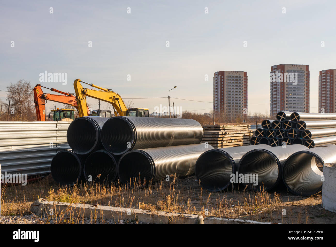 The process of laying of engineering and heating systems. black plastic pipes. construction of pipelines for domestic water supply Stock Photo