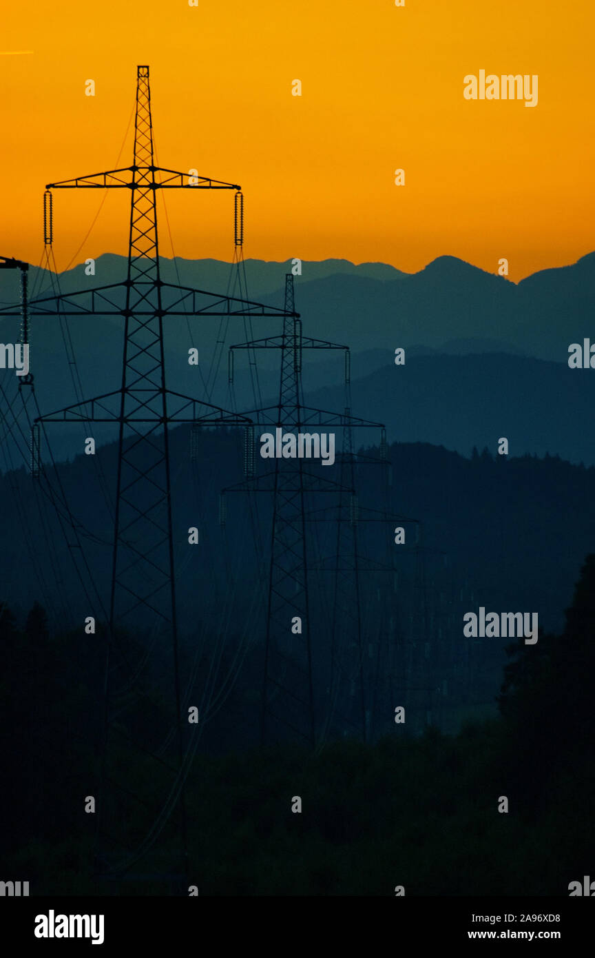 Silhouette of high voltage transmission power line after sunset ...