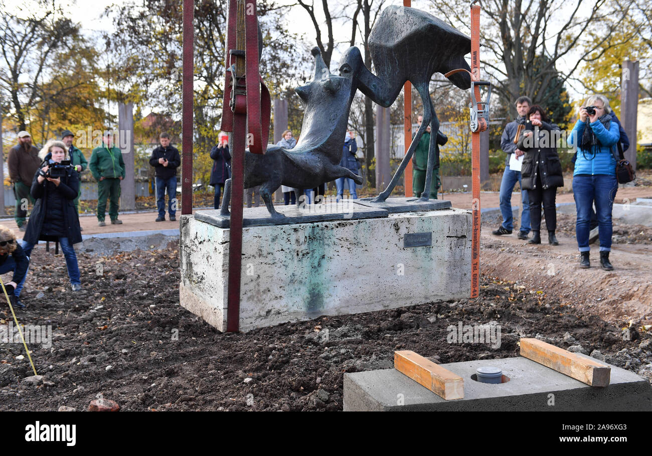 Erfurt, Germany. 13th Nov, 2019. The bronze sculpture 'Fox and Stork' by the artist Harald Stieding will be placed on a foundation stone in the newly designed Rosengarten in egapark in preparation for the Federal Garden Show Erfurt 2021. A total of 4300 roses in 400 varieties are available for replanting. In future, roses and shrubs will be shown in a new thematic design on 1700 square metres of planting areas. Credit: Martin Schutt/dpa-Zentralbild/dpa/Alamy Live News Stock Photo