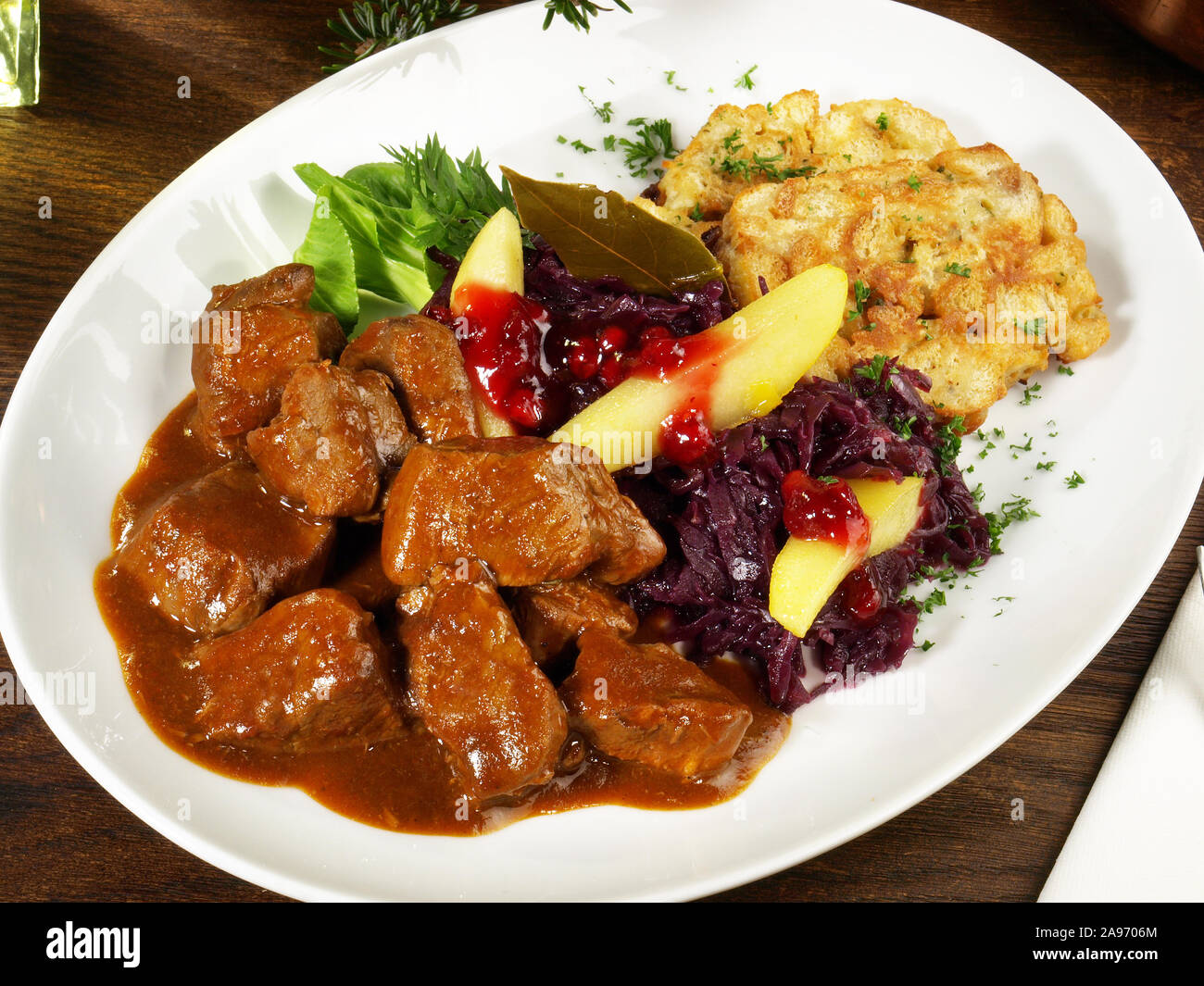Deer Ragout with red Cabbage and Cranberries Stock Photo - Alamy