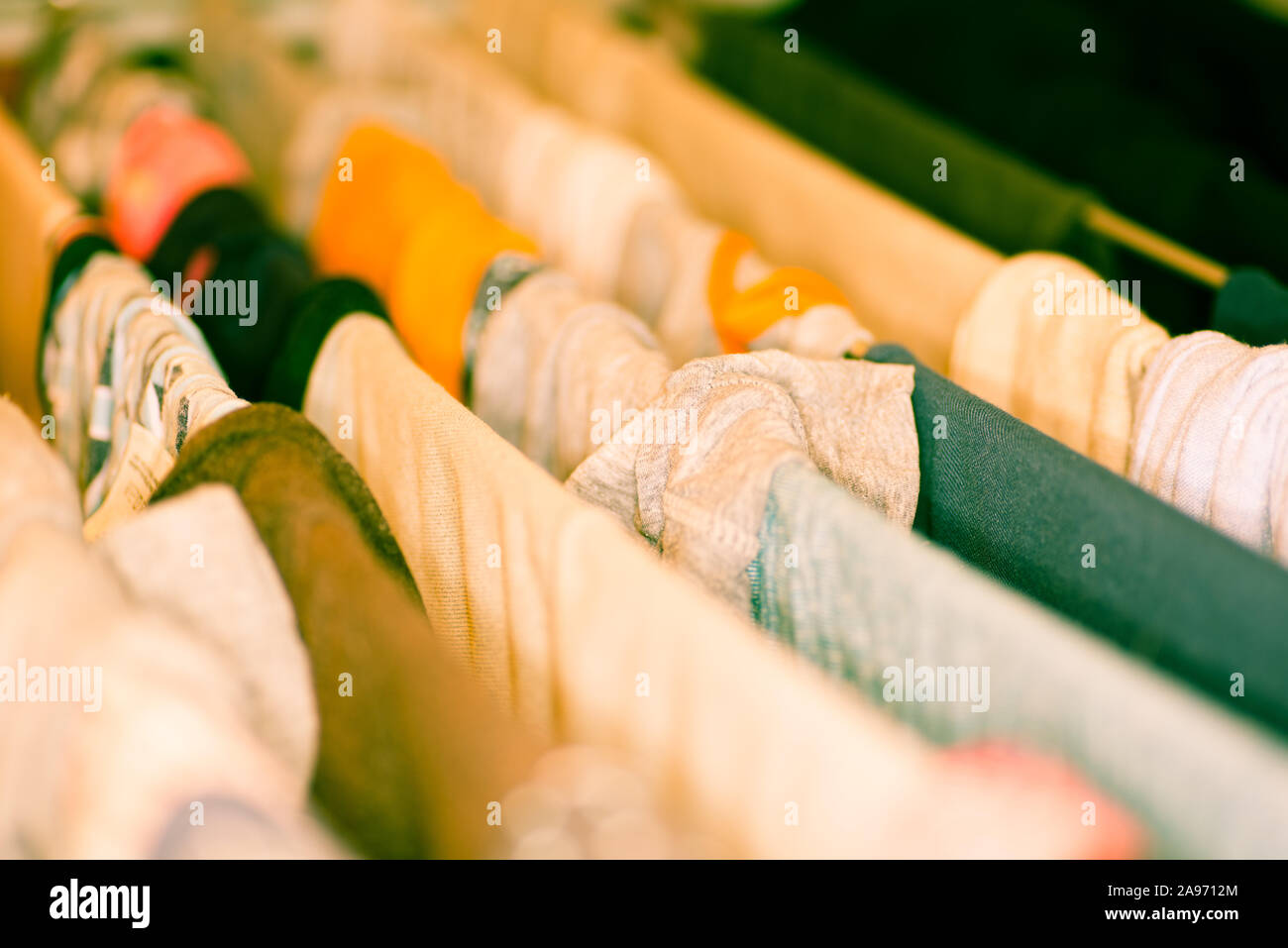 Colourful laundry drying on airer inside the house Stock Photo
