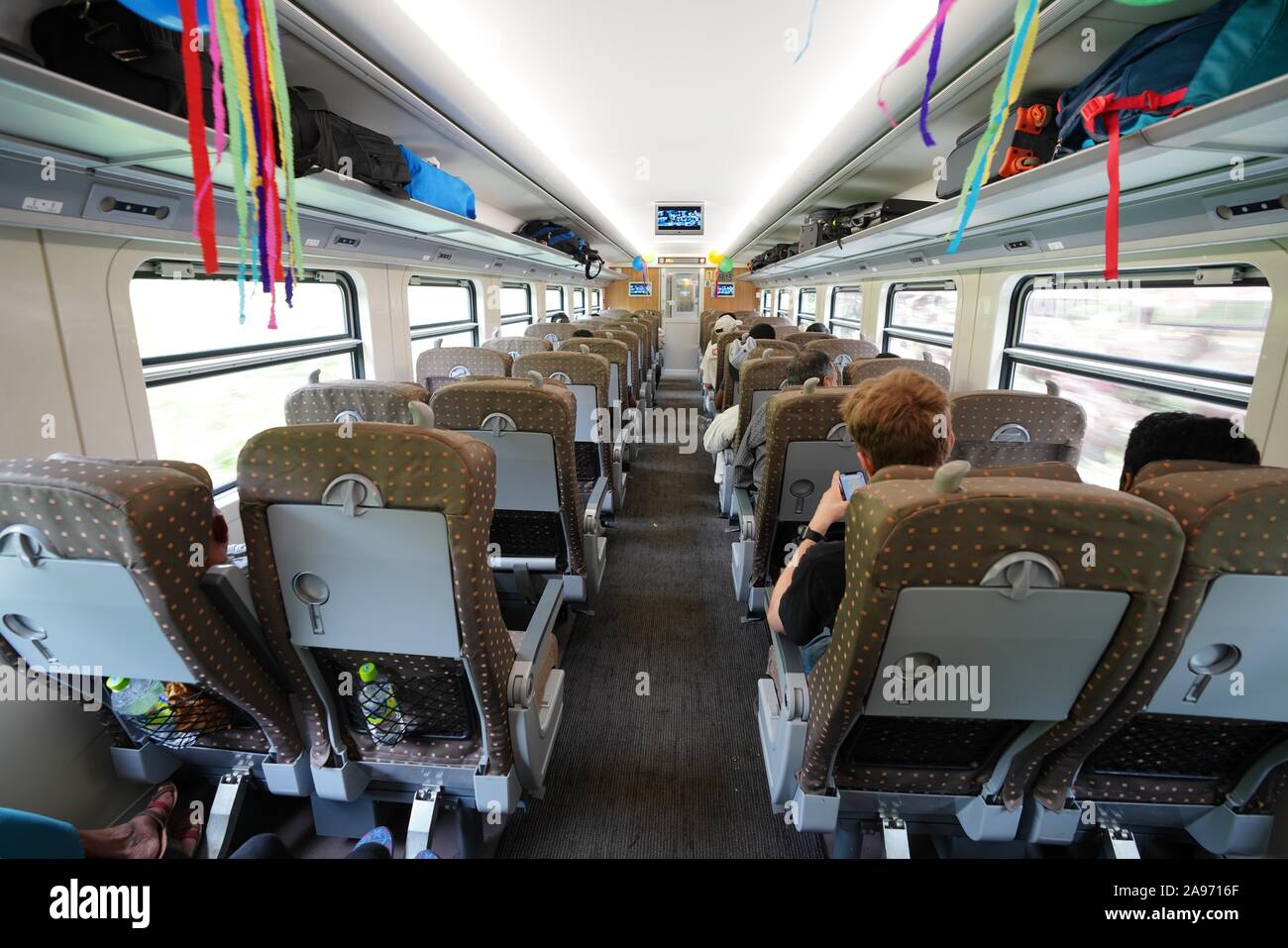 (191113) -- COLOMBO, Nov. 13, 2019 (Xinhua) -- Photo taken on Nov. 2, 2019 shows the first-class car of a Chinese-made train, which is air-conditioned and equipped with TVs, in Sri Lanka. Sri Lanka has always been regarded by travel enthusiasts as "a country with the most beautiful railway network in the world." TO GO WITH "Feature: Chinese-made train makes mountain rail travel in Sri Lanka smoother than ever" (Xinhua/Tang Lu) Stock Photo