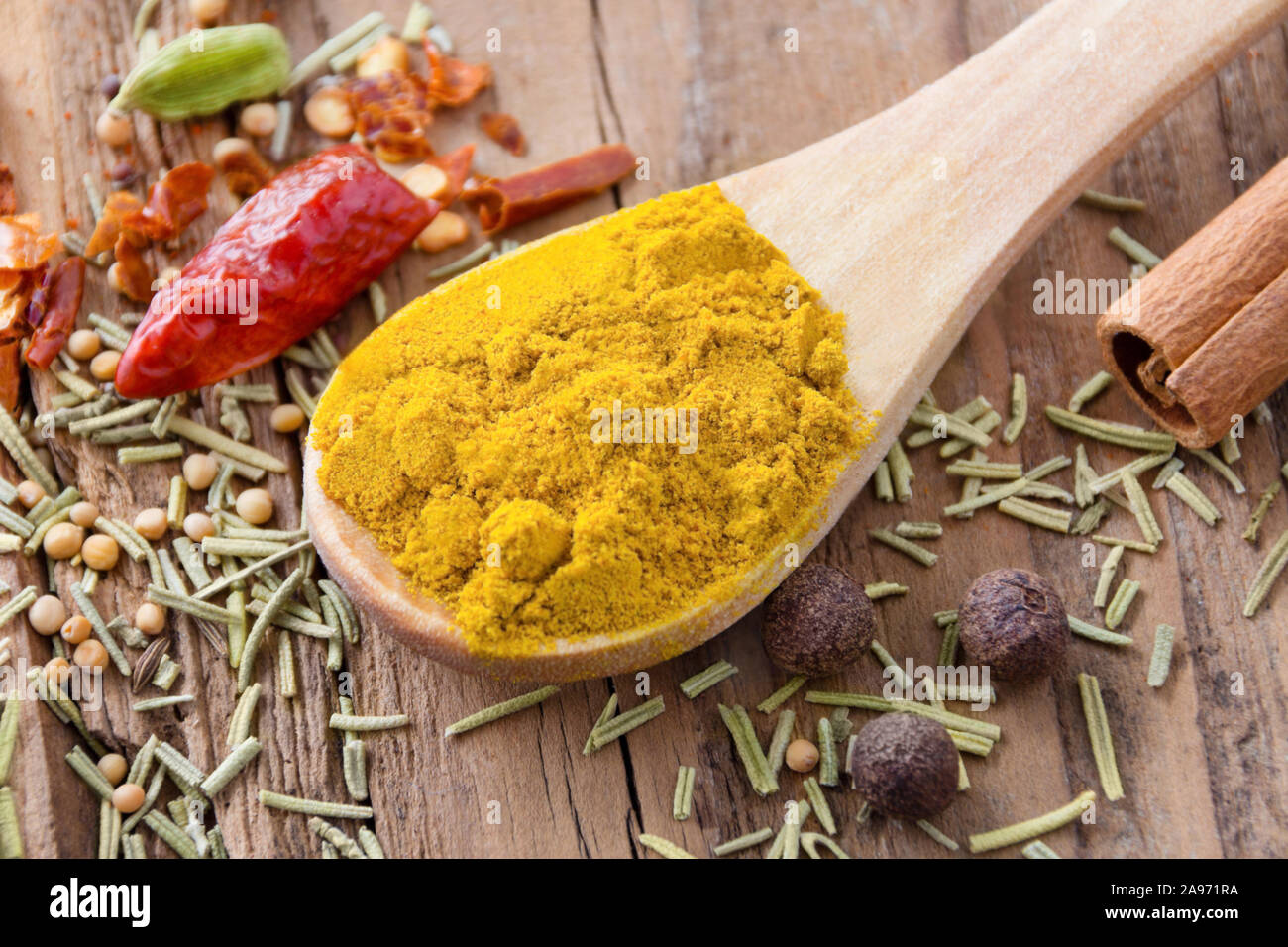 Curry powder and various spices Stock Photo