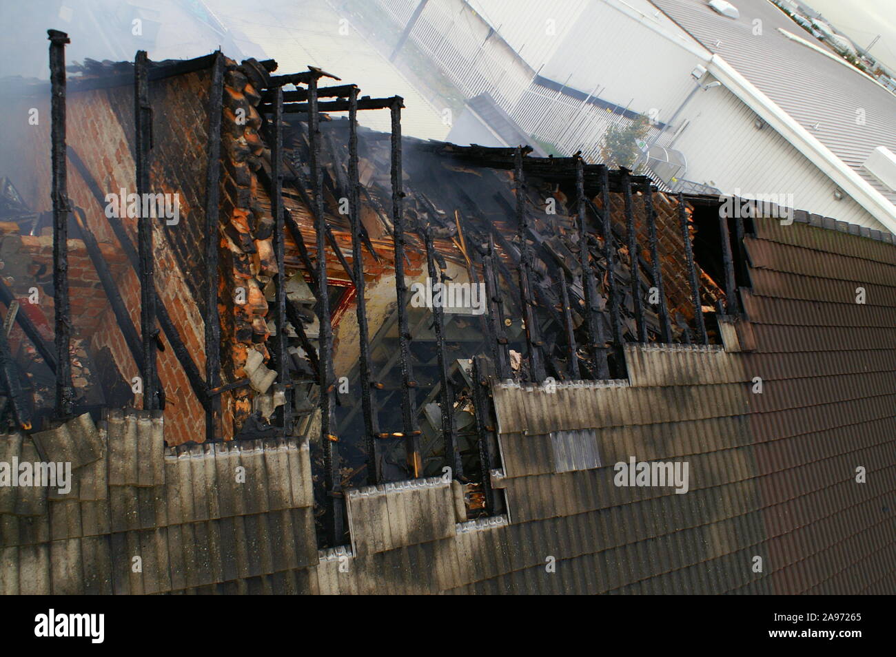 fire damage tiled roof, house fire Stock Photo Alamy