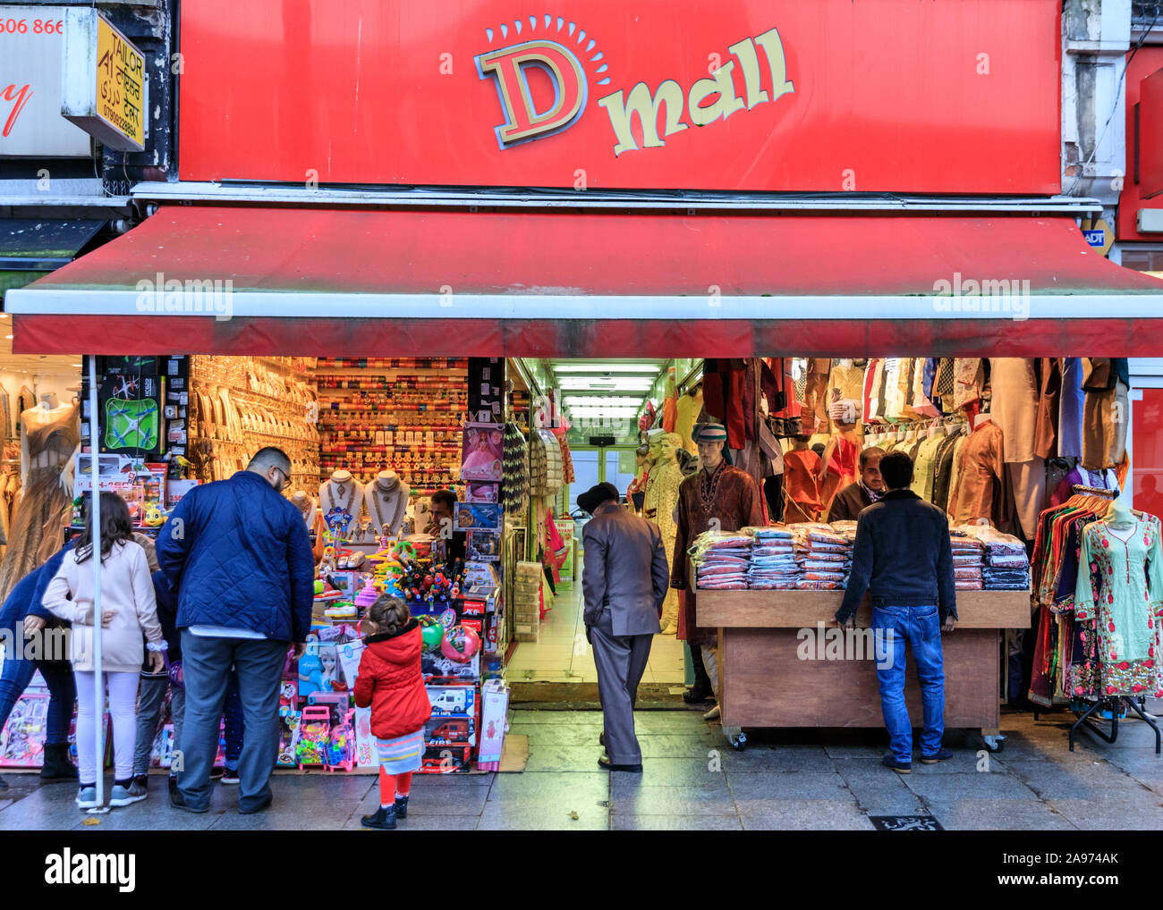 D Mall Asian clothing shops exterior view of people browsing, Southall High Street, London, UK Stock Photo