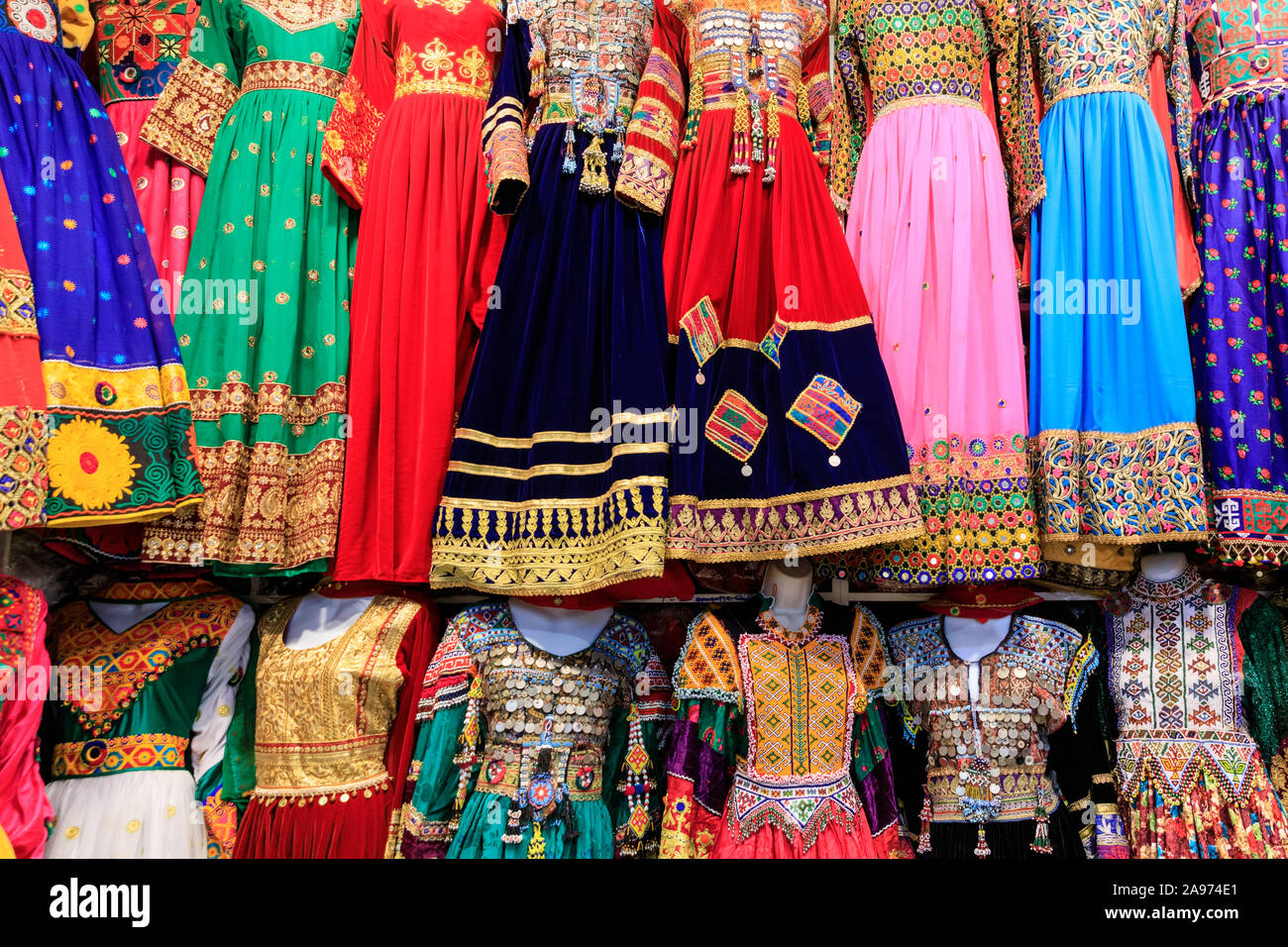Afghani traditional dresses and colourful Afghan Asian clothing in shop display Stock Photo