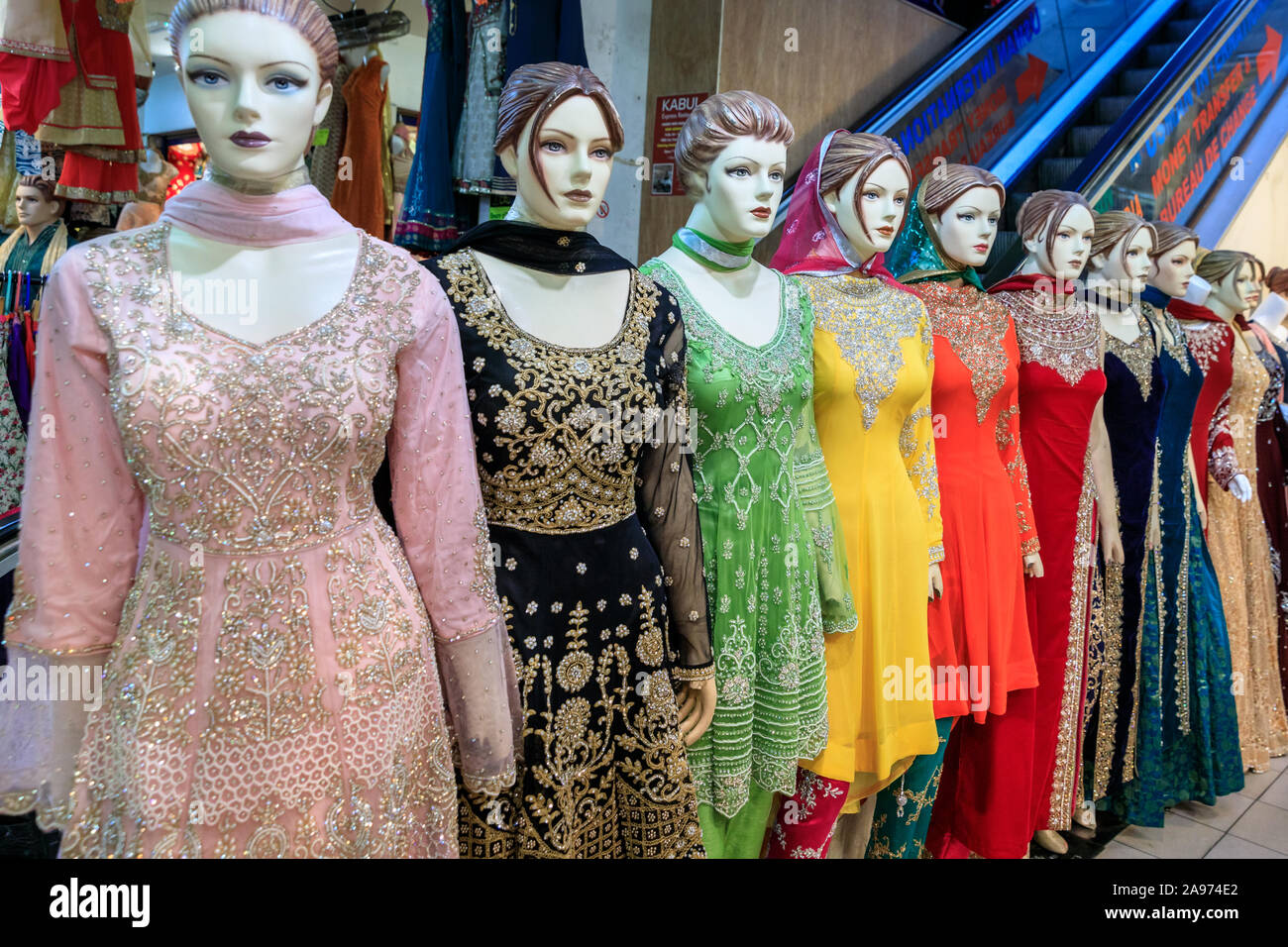 Punjabi, Indian and Asian dresses and saris on display, traditional, colourful clothes on mannequins in a shop in Southall, London, UK Stock Photo
