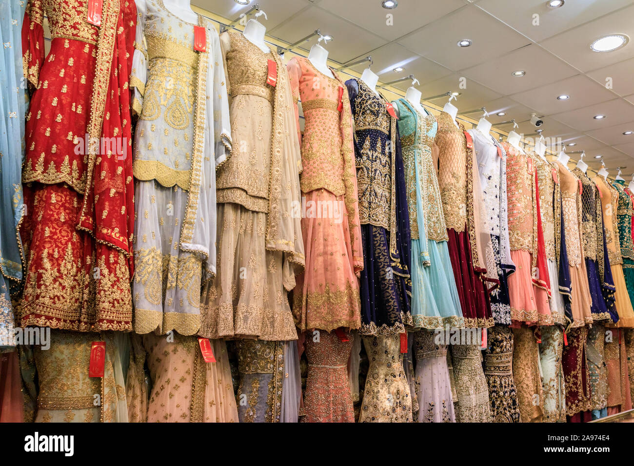 Punjabi, Indian and Asian dresses and saris on display, traditional,  colourful evening wear and clothes in a shop in Southall, London, UK Stock  Photo - Alamy