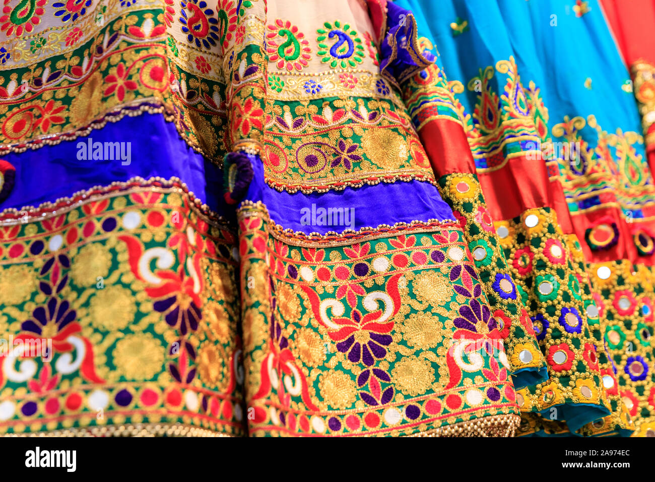 Afghani traditional dresses,detail shot of stitching and embroidery on colourful Afghan Asian clothing in shop display Stock Photo