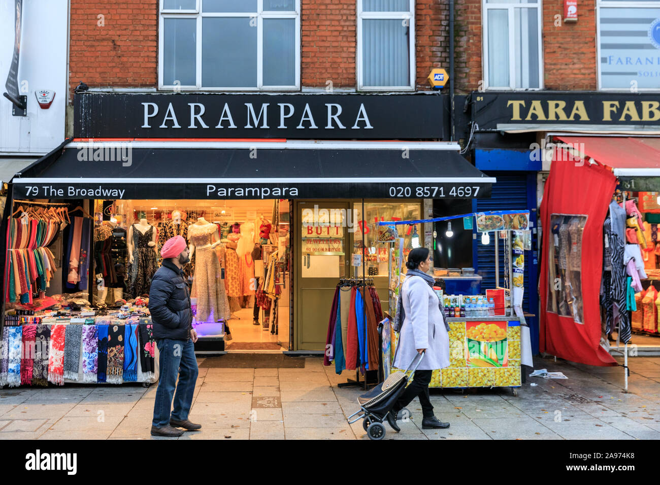 D Mall Asian clothing shops exterior view of people browsing, Southall High Street, London, UK Stock Photo