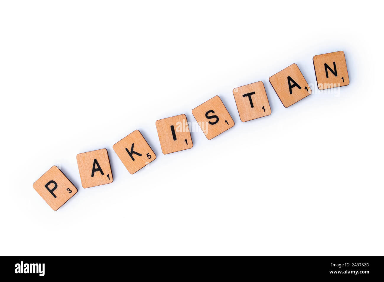 London, UK - July 8th 2019: The word PAKISTAN, spelt with wooden letter tiles over a white background. Stock Photo
