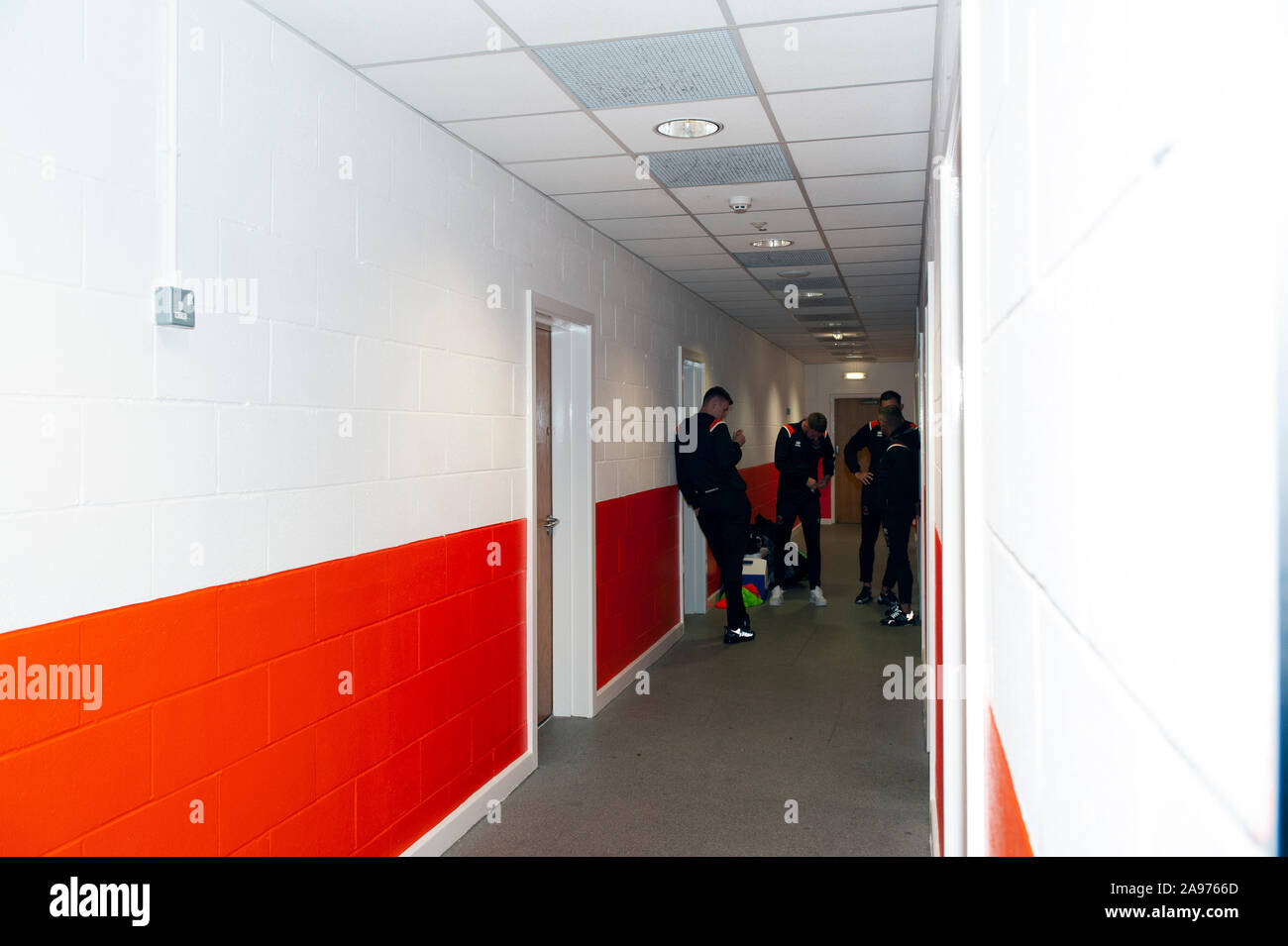 Football Players at Blackpool Football Club are waiting in the corridor for the match to start Stock Photo
