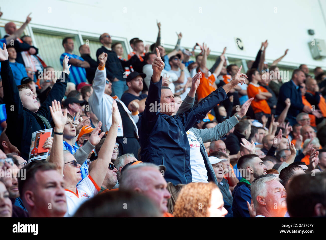 Football Supporters are cheering and supporting their team at Blackpool Football Club Stock Photo