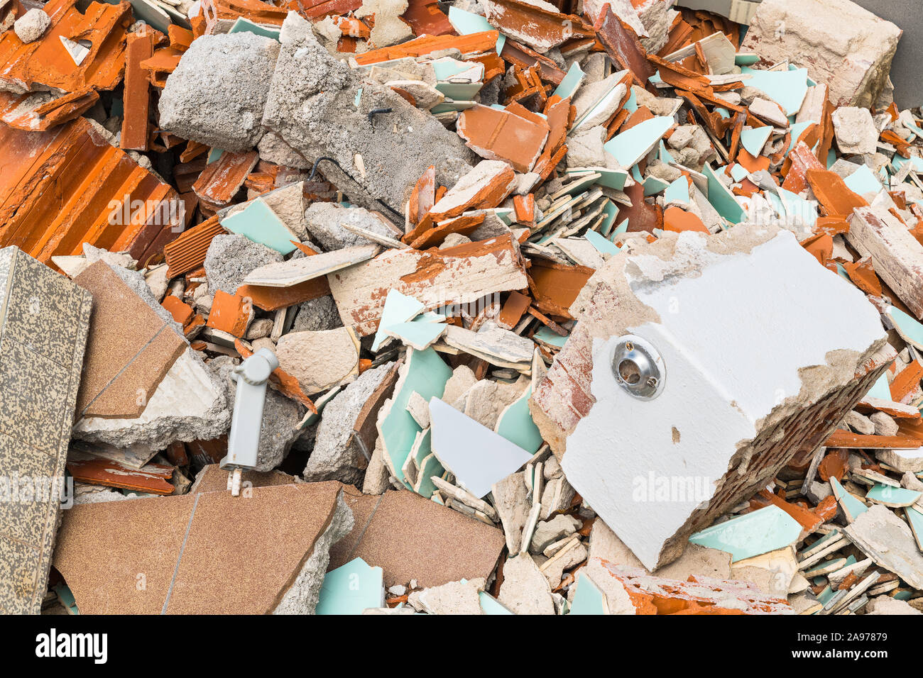 Construction waste dump detail. Rubble pile of broken bricks, tiles and