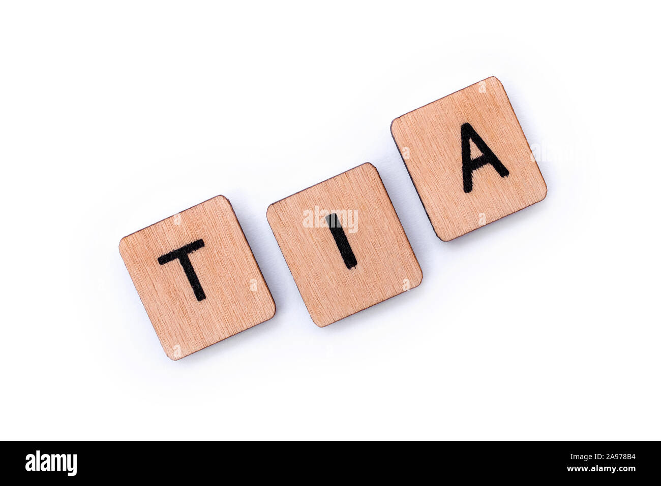 The abbreviation TIA - meaning Transient Ischemic Attack - the medical term for a mini-stroke, spelt with wooden letter tiles over a white background. Stock Photo