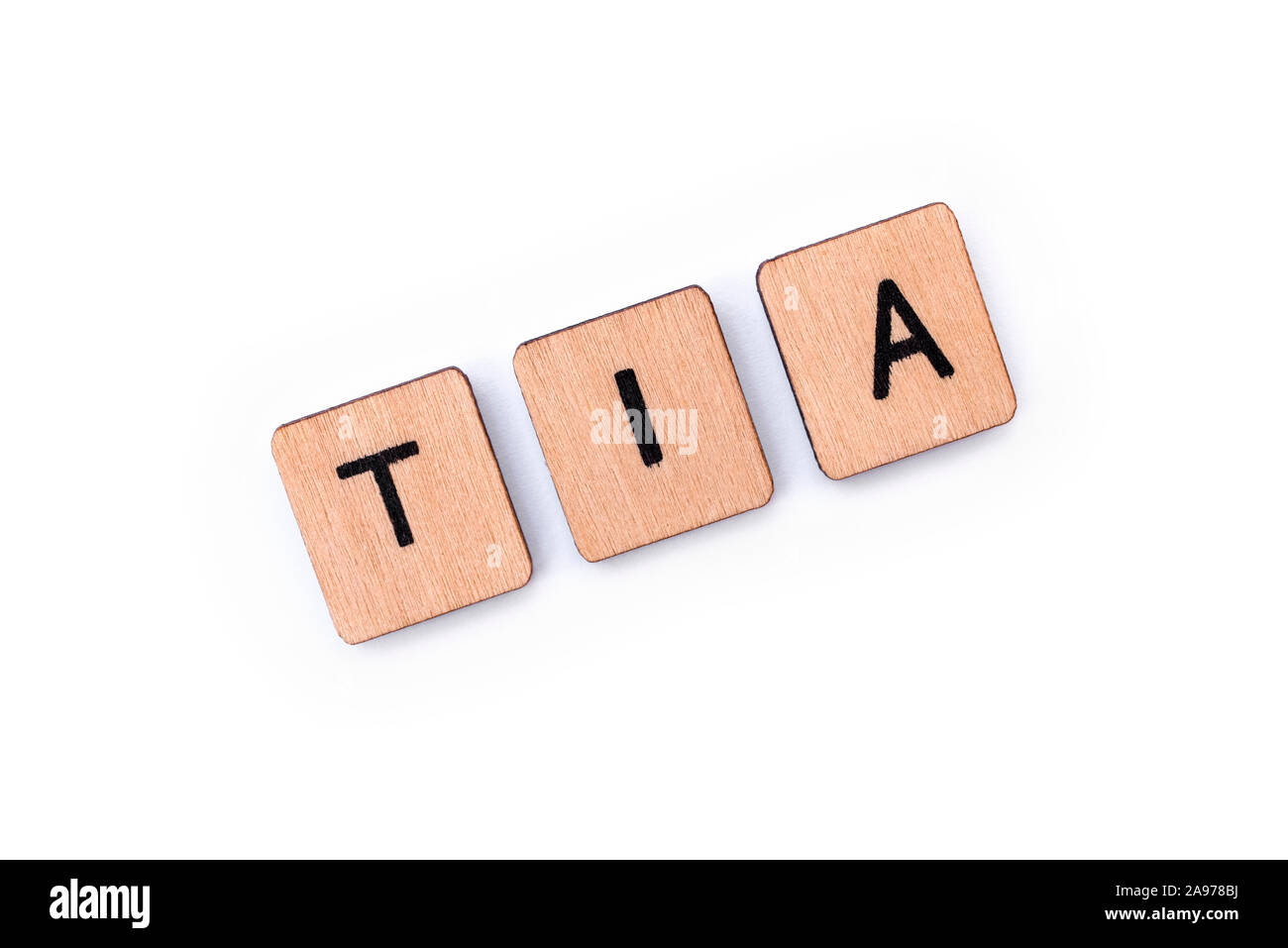 The abbreviation TIA - meaning Transient Ischemic Attack - the medical term for a mini-stroke, spelt with wooden letter tiles over a white background. Stock Photo