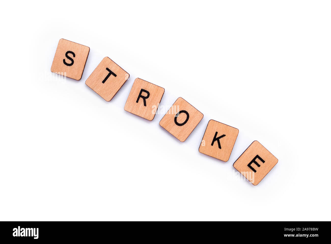 The word STROKE, spelt with wooden letter tiles over a white background