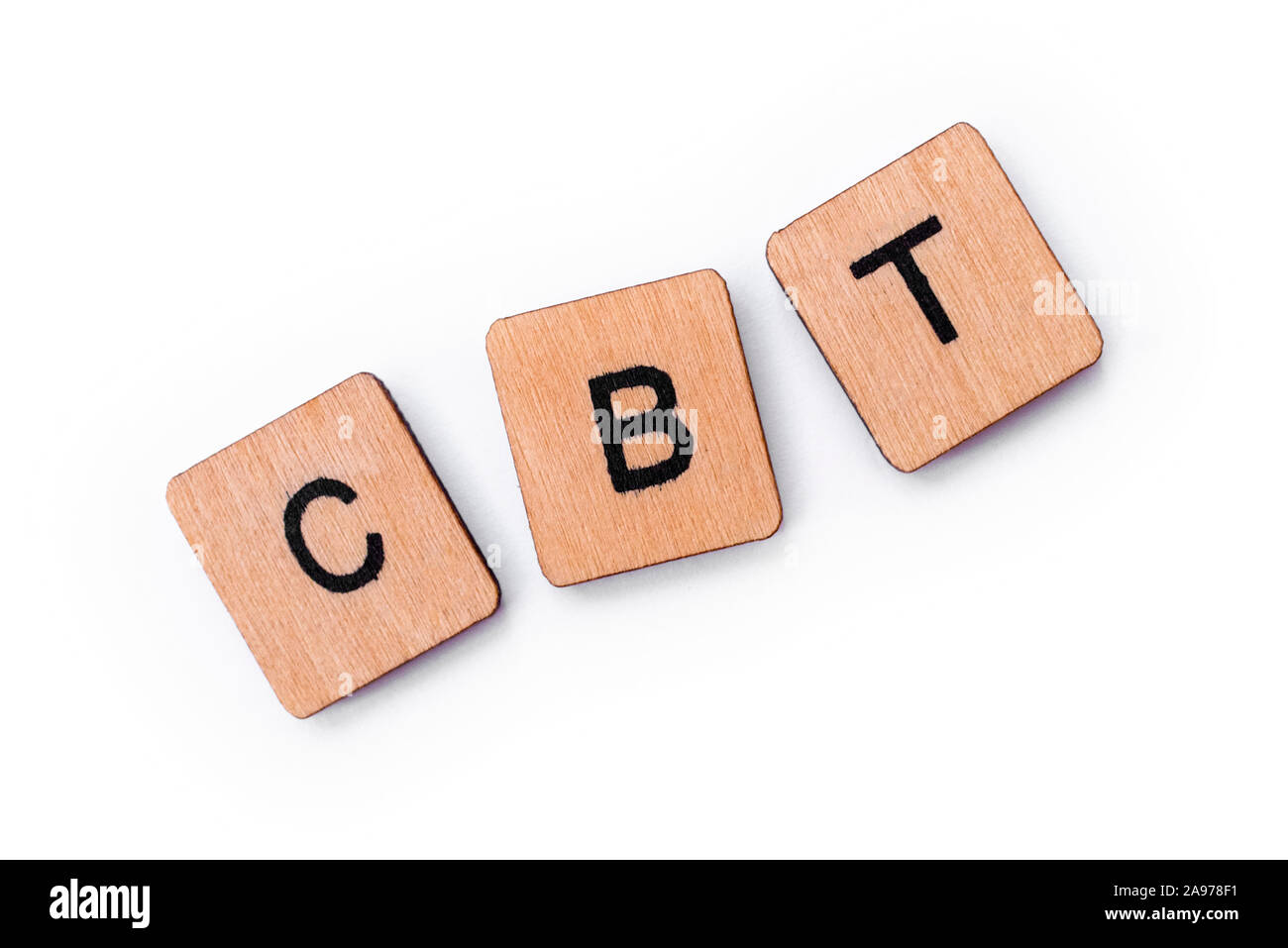 The abbreviation CBT - standing for Cognitive Behavioral Therapy, spelt with letter tiles over a white background. CBT is a psycho-social intervention Stock Photo