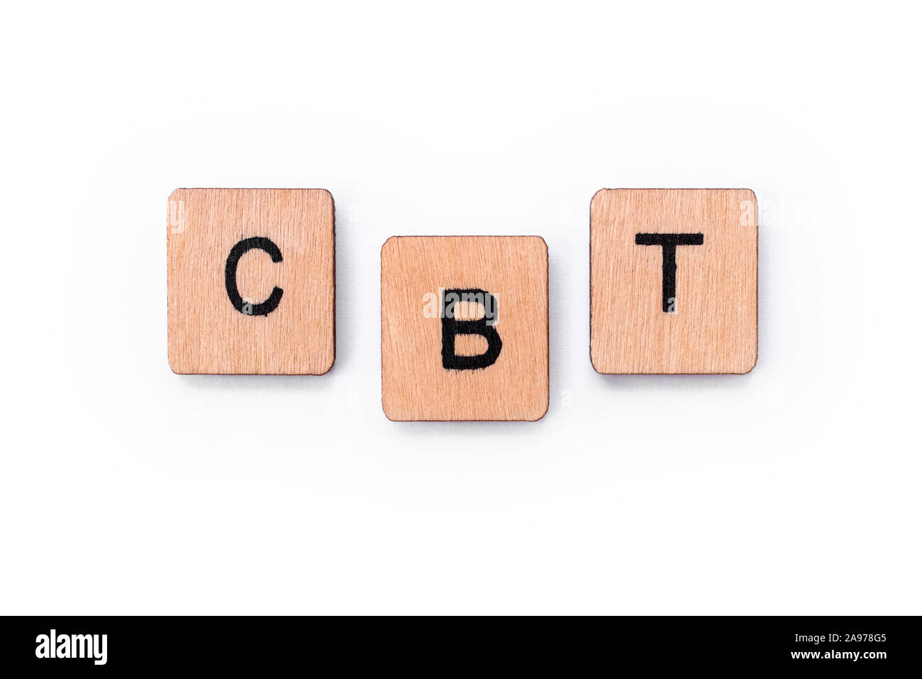 The abbreviation CBT - standing for Cognitive Behavioral Therapy, spelt with letter tiles over a white background. CBT is a psycho-social intervention Stock Photo