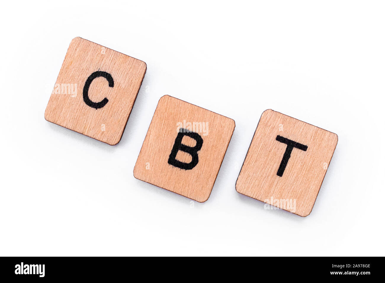 The abbreviation CBT - standing for Cognitive Behavioral Therapy, spelt with letter tiles over a white background. CBT is a psycho-social intervention Stock Photo