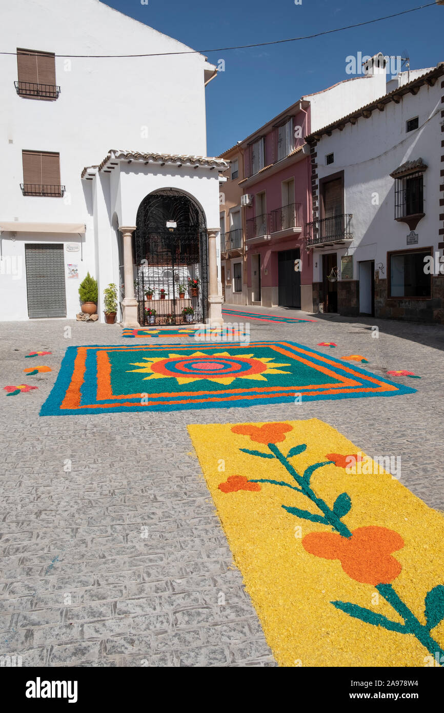 Colorful carpets of wood chippings in the streets created by the community during Corpus Christi 2019, Carcabuey, Cordoba, Andalucia. Spain Stock Photo