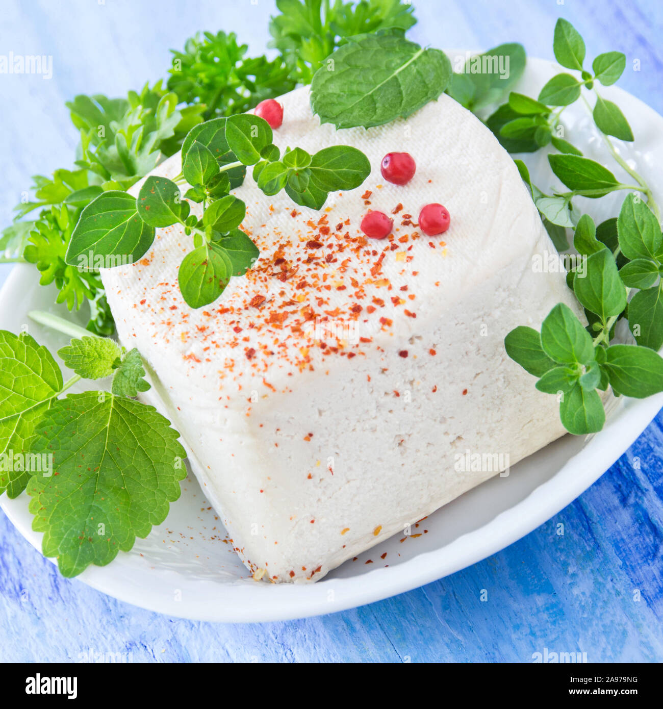 Tofu bean curd and herbs Stock Photo Alamy