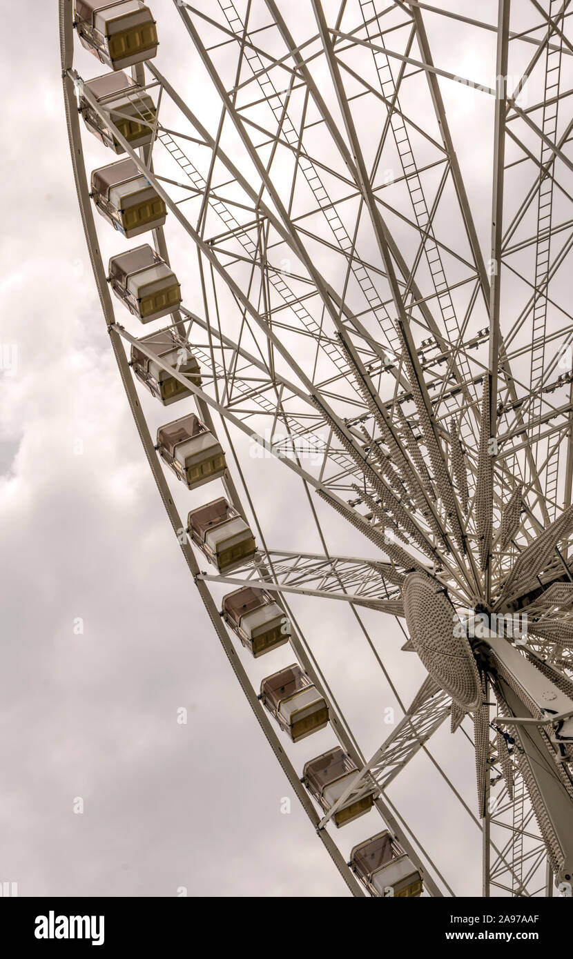 Fair ferris wheel in the central square of Budapest in a cloudy day. Stock Photo