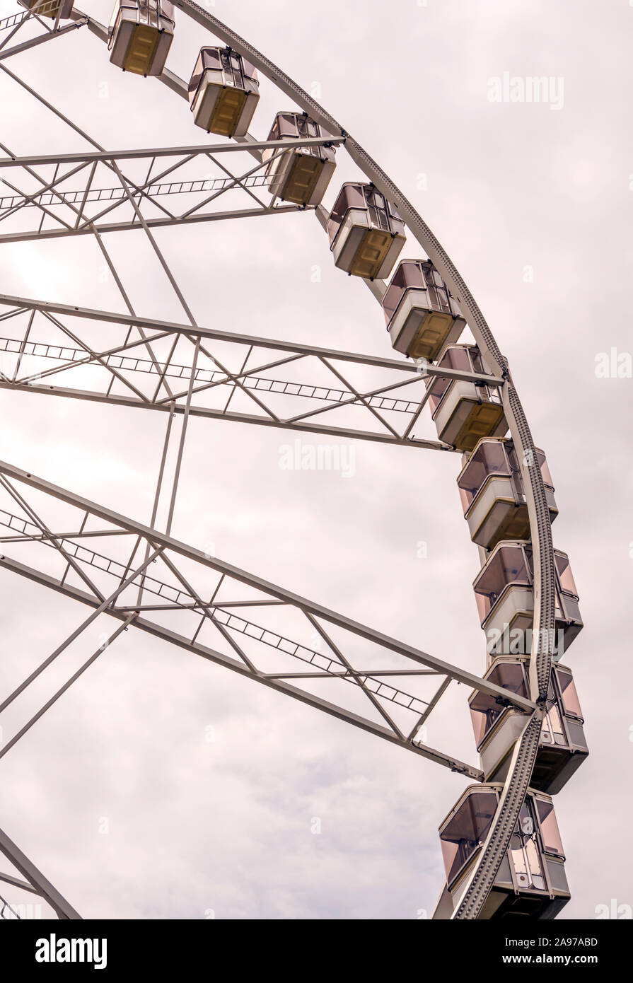 Fair ferris wheel in the central square of Budapest in a cloudy day. Stock Photo