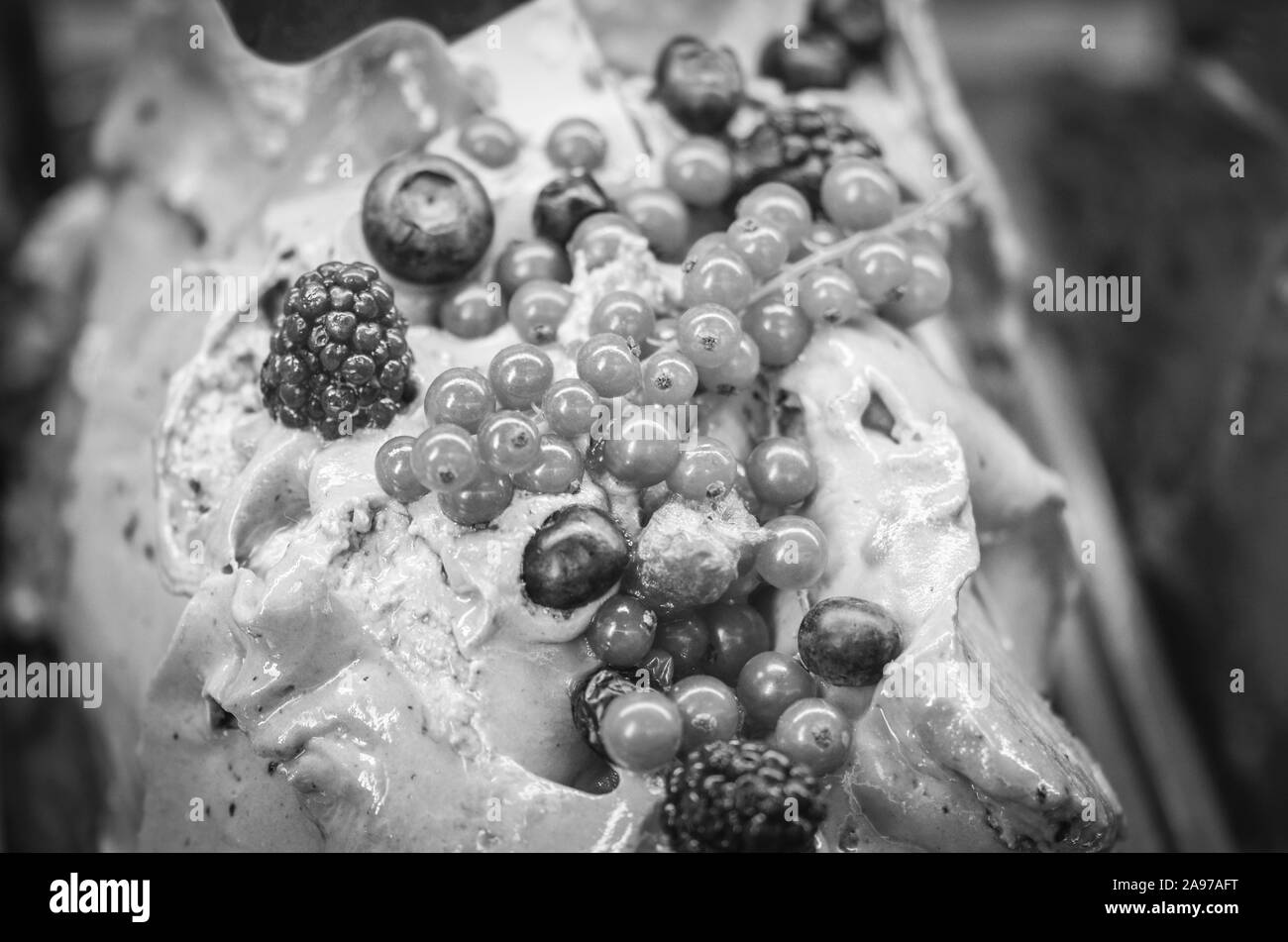 delicious italian ice-cream wit fresh fruits & mix of nuts, seeds, pistachio, chocolate flakes Stock Photo