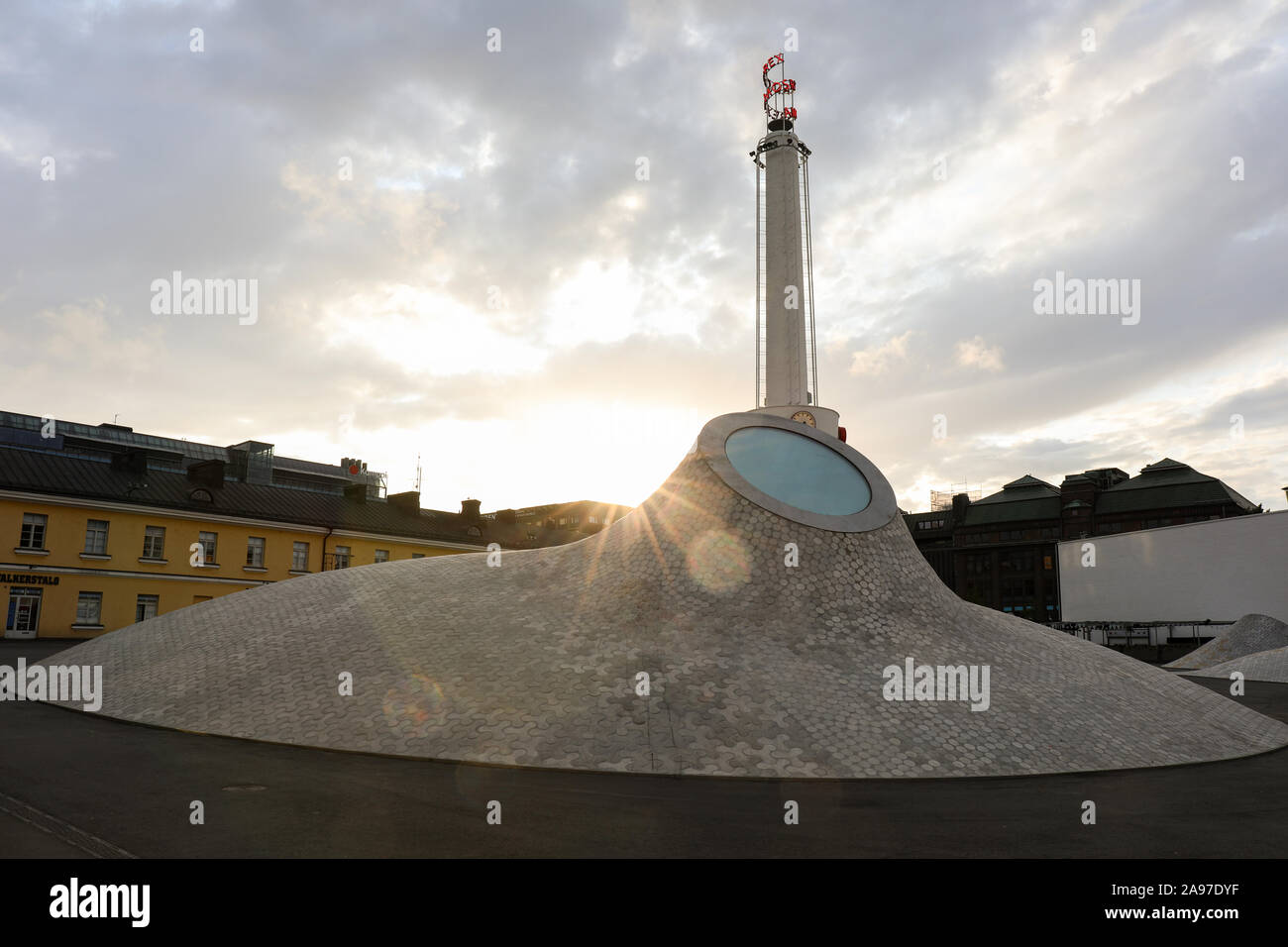 Setting sun behind Amos Rex subterranean art museum skylight at Lasipalatsi plaza in Helsinki, Finland Stock Photo