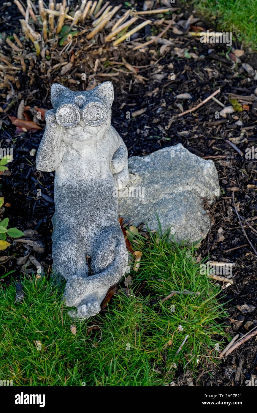 cement, garden ornament, cat, binoculars Stock Photo Alamy