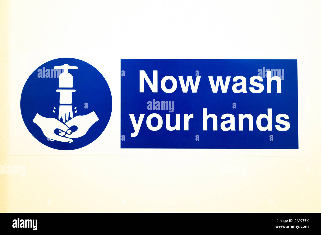 Sign notice Now Wash Your Hands Stock Photo