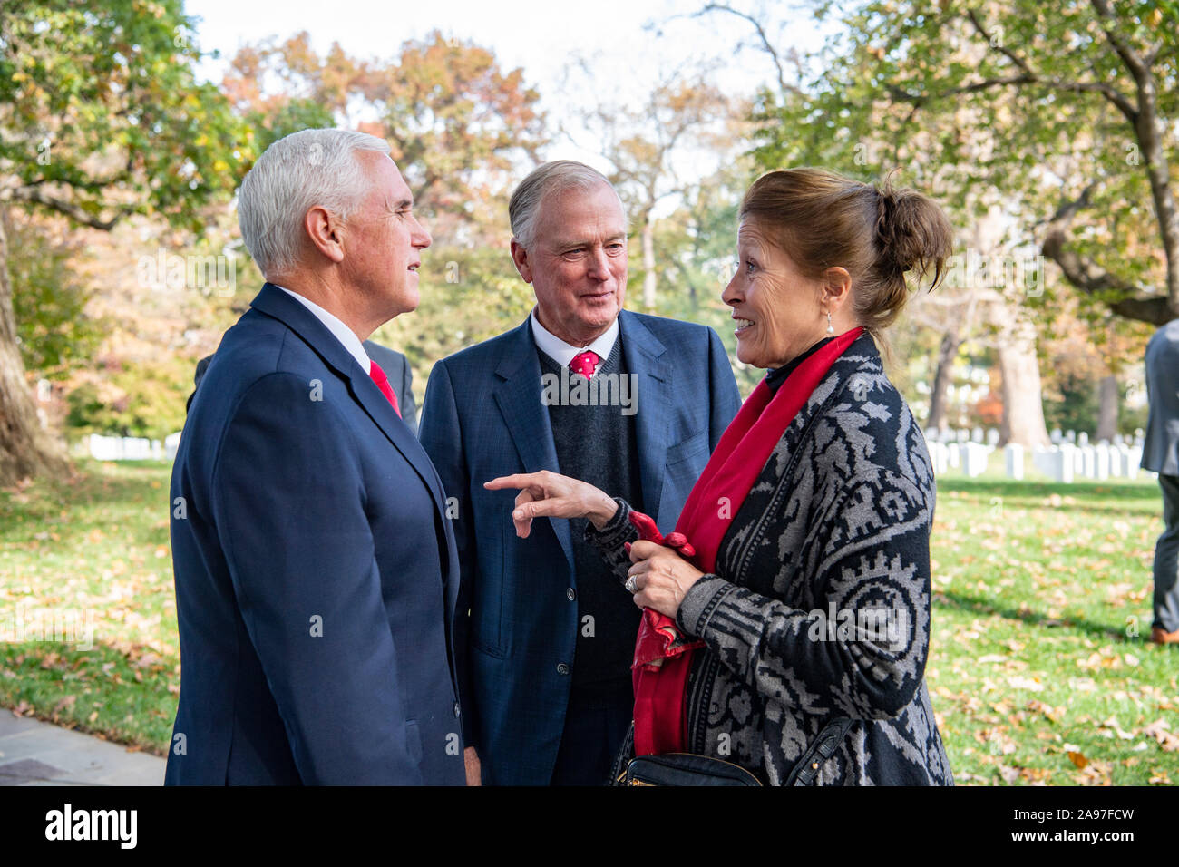 U.S Vice President Mike Pence chats with former Vice President Dan Quayle, center, and his wife, Marilyn Quayle, right, upon his arrival for Veterans Day Observations at the Arlington National Cemetery November 11, 2019 in Arlington, Virginia. Stock Photo