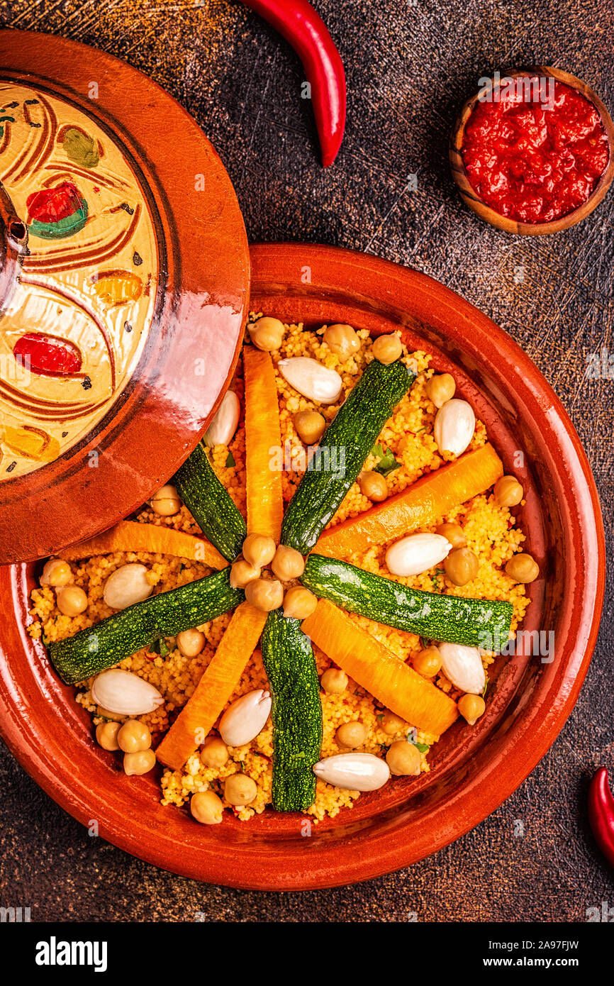 Vegetable tagine with almond and chickpea couscous, top view Stock