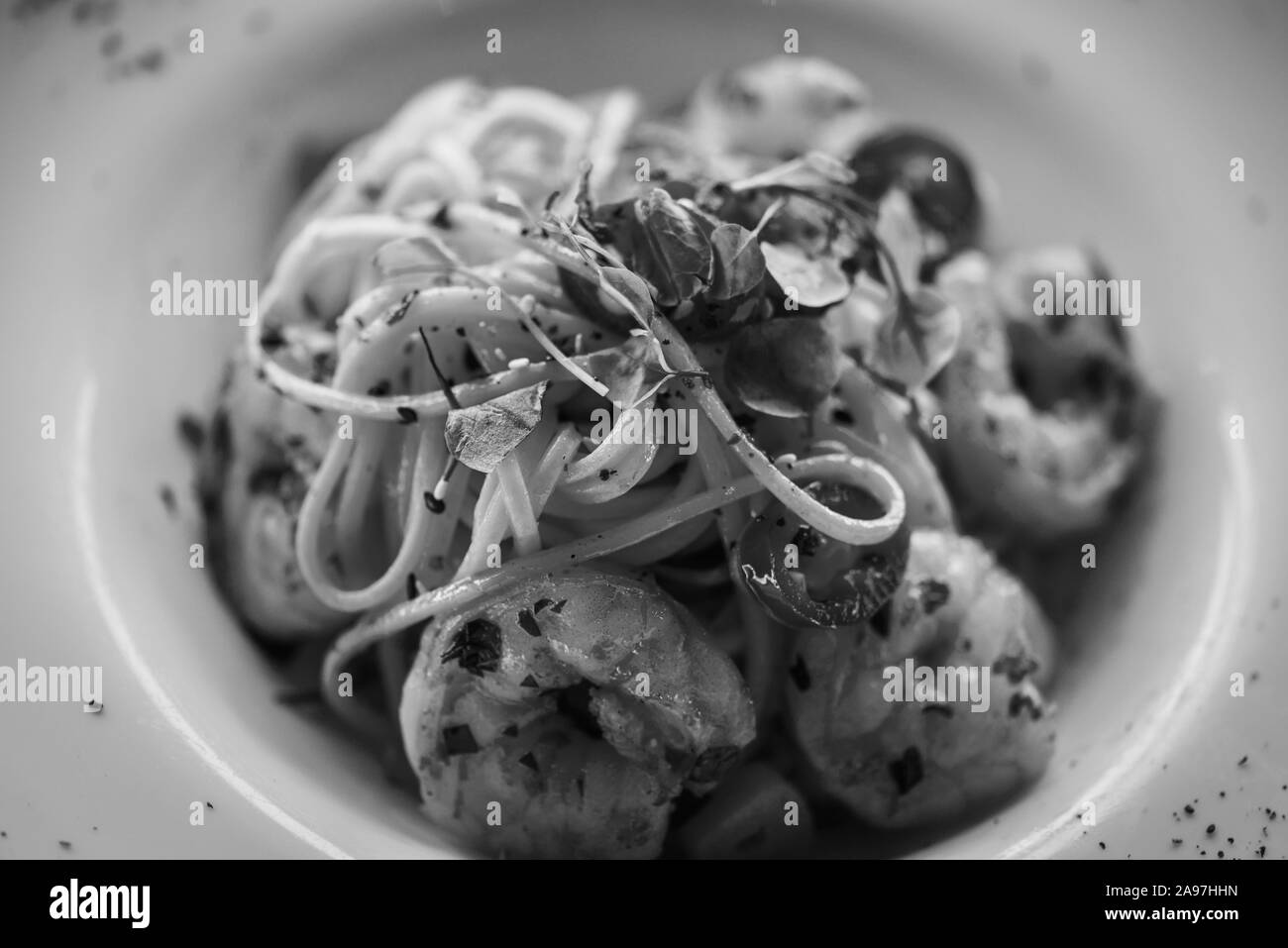 delicious home made italian pasta with fresh vegetables & shrimps Stock Photo